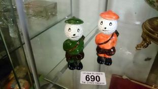A pair of Carlton ware golfing figures