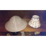 A glass lamp shade and one other