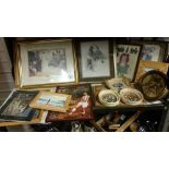 A shelf of framed and glazed prints etc