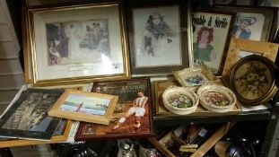 A shelf of framed and glazed prints etc