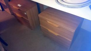 A pair of teak bedsides