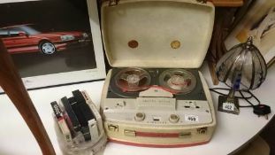 A reel to reel tape recorder with tapes