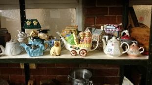 A shelf of collector's teapots