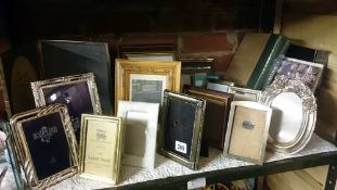 A shelf of assorted photo frames