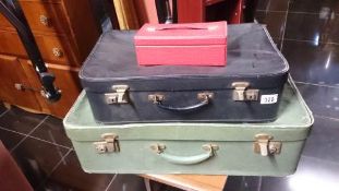 A quantity of vintage suitcases