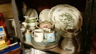 A shelf of miscellaneous including meat platters