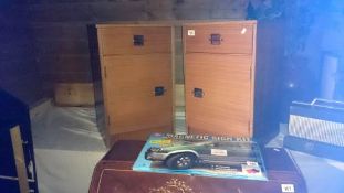 A pair of bedside cabinets