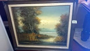 An oil on canvas lake scene