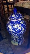 A large blue and white ginger jar