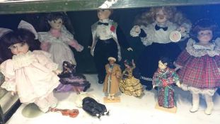 A quantity of dolls