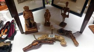 3 vintage corkscrews and 3 carved wood figures