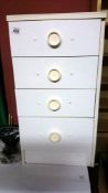 A white 4 drawer chest