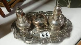A silver plate cruet set