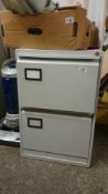 A 2 drawer metal filing cabinet with keys