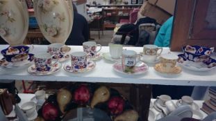 A mixed lot of vintage tea cups and saucers