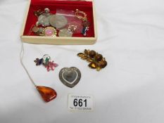 A mixed lot of costume jewellery including silver book mark and amber pendant with gold chain