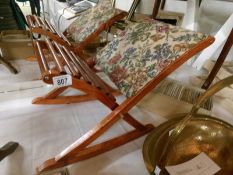 A gout stool with tapestry cover