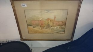 A framed and glazed watercolour cottage scene