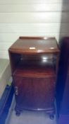 A mahogany bedside cabinet