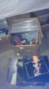 A box of progressive rock LP records including several David Bowie, Jimi Hendrix, Kevin Ayers,