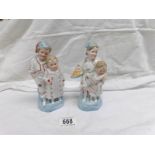 A pair of 19th century continental porcelain seated girl figures