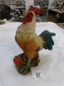 A cockerel figure