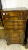 A mahogany secretaire with metal lion head handles