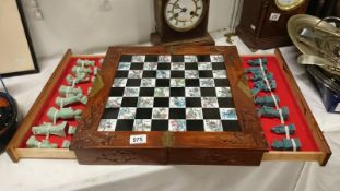 A superb quality oriental style chess set complete with board