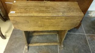 An oak drop leaf table