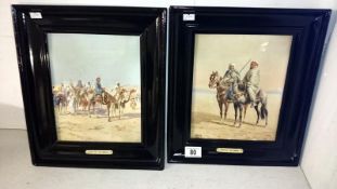 A pair of framed and glazed Rappini prints in black framed 'Sons of the Dessert' and 'Halt of the