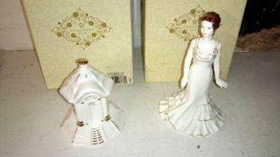 A Coalport figure and a Coalport cottage