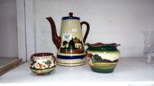 A Torquay pottery coffee pot and 2 other items
 
This is in fair condition
There is a slight chip