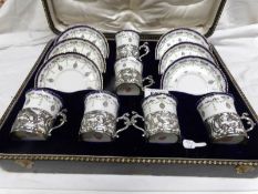 A cased set of Royal Worcester William Comyns 1905 coffee cans with silver holders.
 
This is in