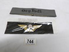 2 Nazi items being a railway officer's cap cockade and an 'Organisation TODT' arm band
 
We have