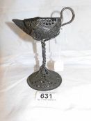 An early fretwork candleholder as a Genie lamp