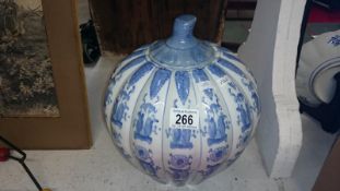 A blue and white pumpkin shaped ginger jar