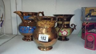 2 large luster ware jugs and a lustre ware urn