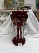 A Victorian hand decorated ruby glass table lustre