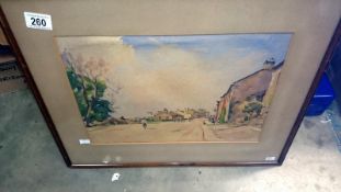 A watercolour street scene signed Fred Lawson,