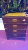 A small 4 drawer chest with brass handles
