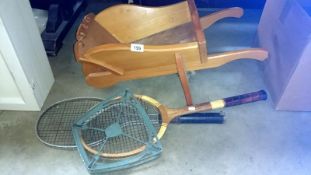 A child's wheelbarrow and contents