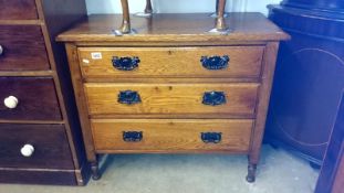 A 3 drawer oak chest