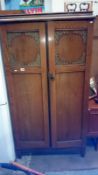 An oak wardrobe
 
Approximate width 37.75”
Approximate depth 19.5”
Approximate height 71”