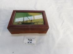 A trinket box with ship picture in lid