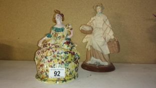 A crinoline lady cookie jar and a figure