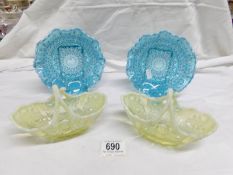 A pair of 19th century vaseline glass baskets and a pair of blue vaseline edged plates