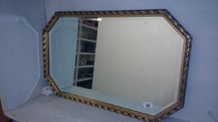 A gilt framed bevel edged mirror