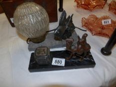 A French marble and spelter angel fish table lamp and a marble and spelter camel inkwell