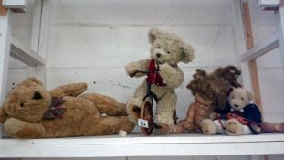 A vintage doll and 3 teddy bears