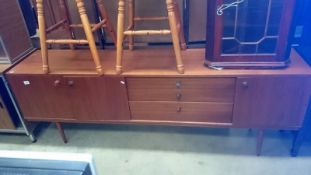 A solid teak sideboard